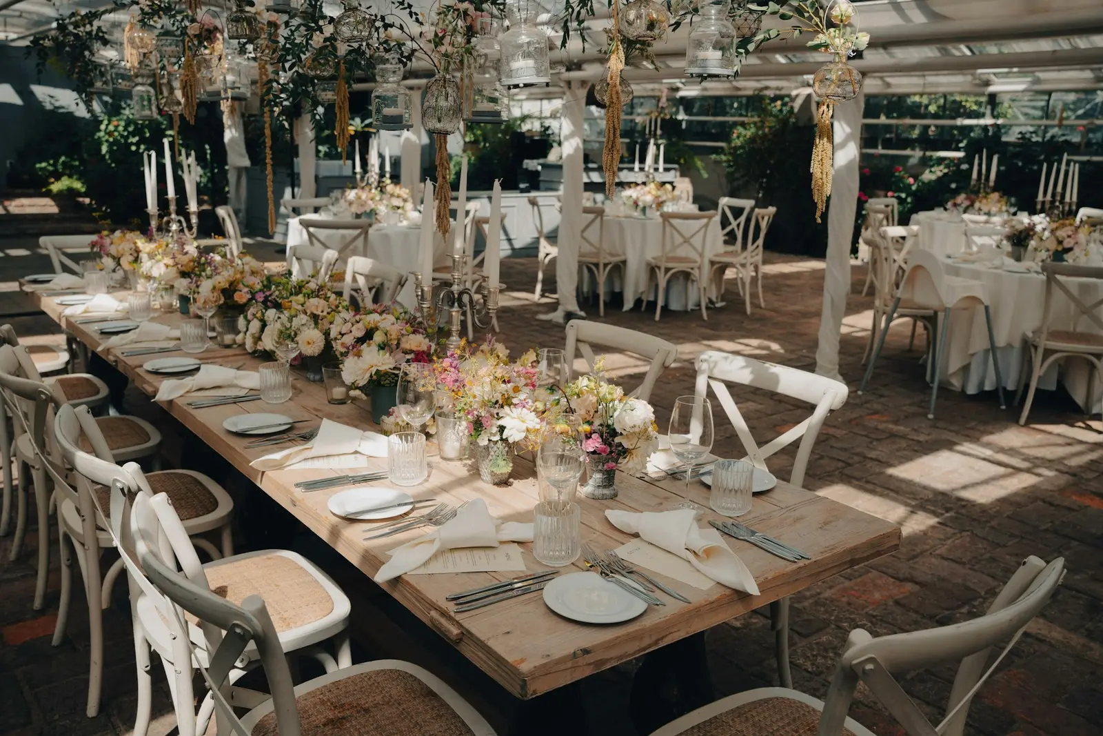 Sunlit venue with a long table set for an event